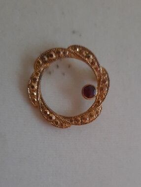 Gold-Tone Floral Circle Brooch with Garnet-Red Accent